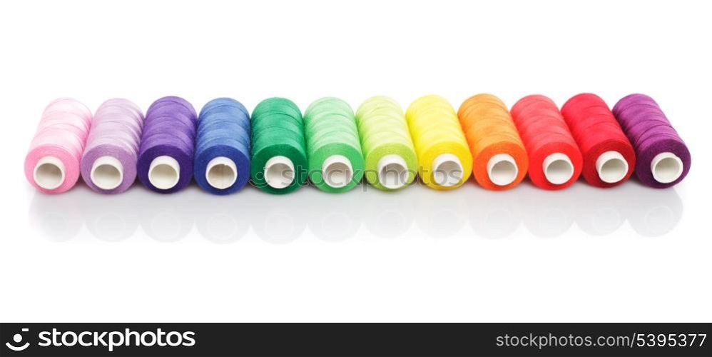 Sewing multicolored threads isolated on white
