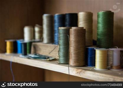 Sewing thread for leather goods.. Leathermaker’s work desk
