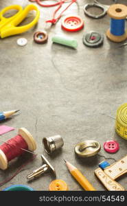 sewing tools and accessories on table background