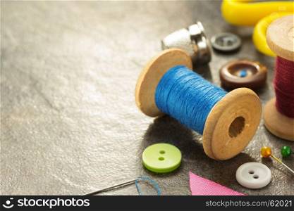 sewing tools and accessories on table background