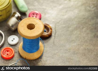 sewing tools and accessories on table background