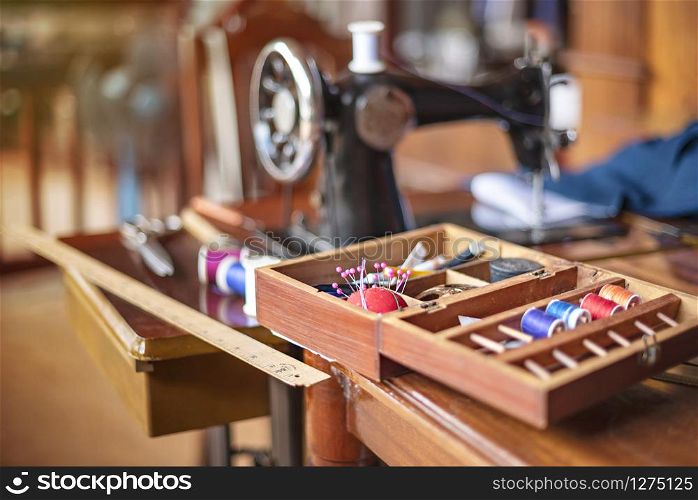 sewing tools and reels of color thread on table. Handmade clothes dressmaking and sewing Concept. sewing tools and reels of color thread on table.