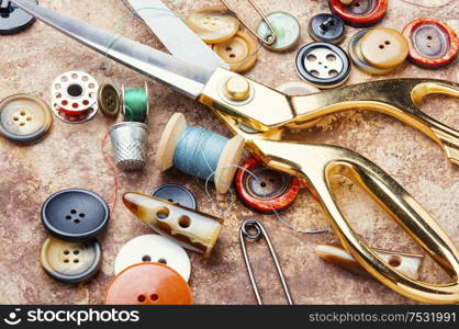 Sewing tools, scissors, many buttons and threads. Set of sewing accessories