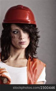 Sex equality and feminism. Sexy girl in safety helmet and orange vest. Attractive woman working as construction worker.