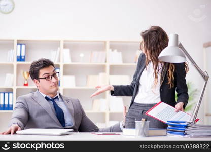 Sexual harassment concept with man and woman in office