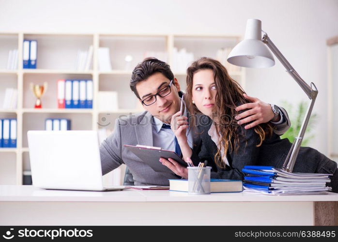 Sexual harassment concept with man and woman in office