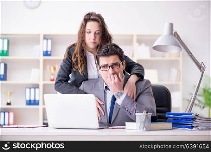 Sexual harassment concept with man and woman in office