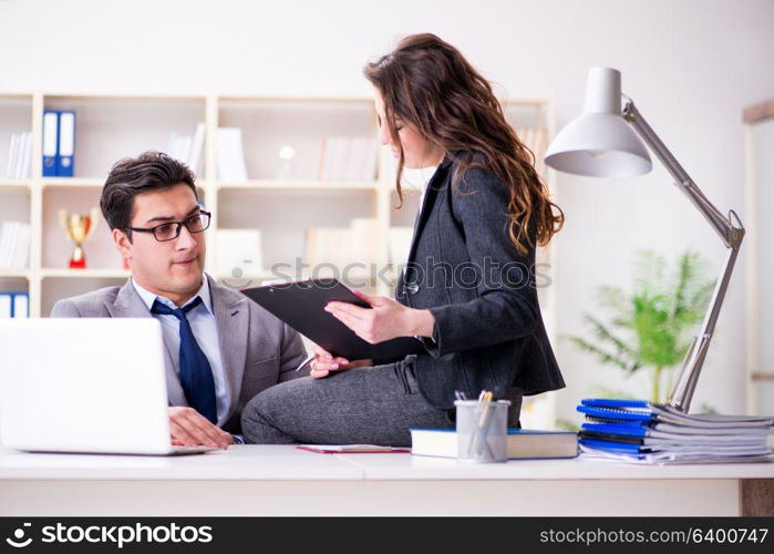 Sexual harassment concept with man and woman in office