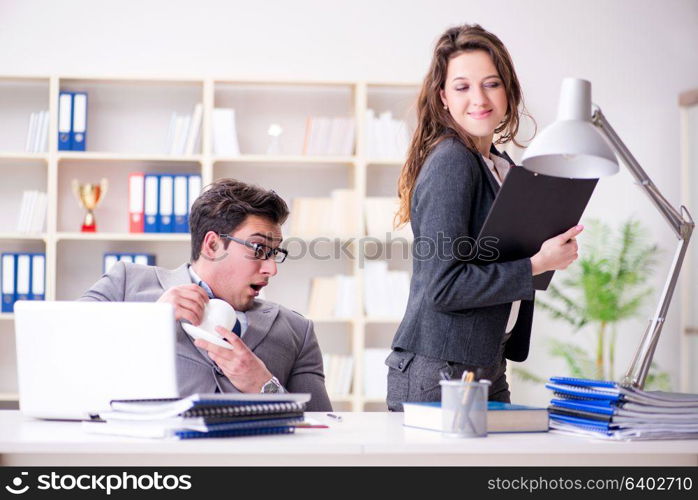 Sexual harassment concept with man and woman in office