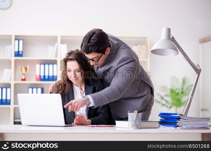 Sexual harassment concept with man and woman in office