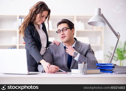 Sexual harassment concept with man and woman in office