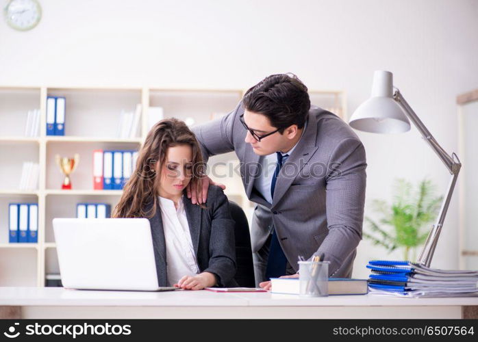 Sexual harassment concept with man and woman in office