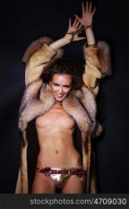 Sexual model in a fur coat