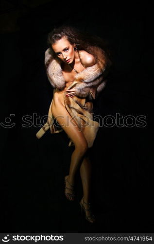 Sexual model in a fur coat