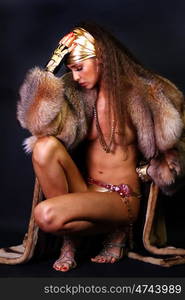 Sexual model in a fur coat