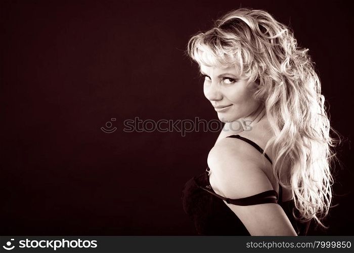 Sexy adult woman in black. Sexiness of women. Attractive sensual blonde adult woman in black on dark background. Sexy lady wearing lingerie.