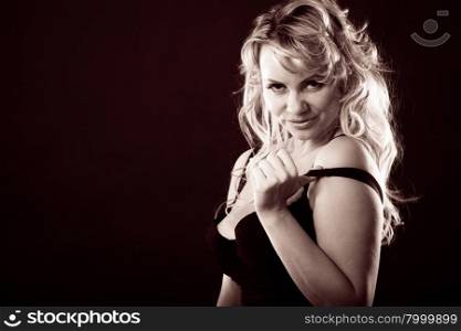 Sexy adult woman in black. Sexiness of women. Attractive sensual blonde adult woman in black on dark background. Sexy lady wearing lingerie.