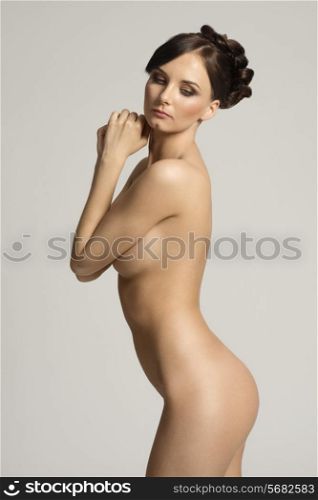 sexy and sweet portarit of a naked young woman , with stunning body , posing in tender way , natural skin