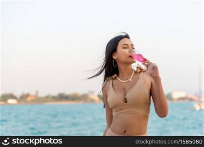 Sexy Asian Women in Bikini with Champagne Glass on her Private Yacht.