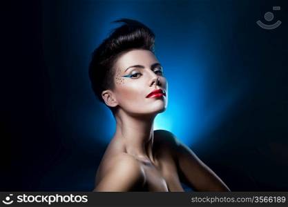 sexy attractive woman with red lips in blue light