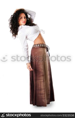 Sexy beautiful Caucasian Hispanic Latina young woman with brown curley hair leaning backwards. Cute tanned brunette, ethnic girl in white knotted shirt and brown skirt standing showing belly, isolated.