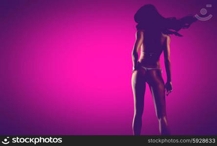 sexy bikiny woman at pink background