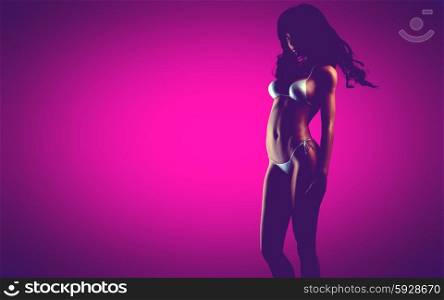 sexy bikiny woman at pink background
