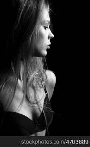 Sexy blond in black lingerie over dark background &#xA;&#xA;