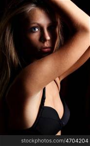 Sexy blond in black lingerie over dark background &#xA;&#xA;