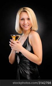 Sexy blonde standing with goblet in both hands