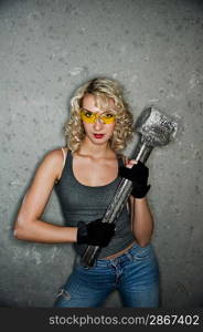 Sexy blonde with big metal hammer