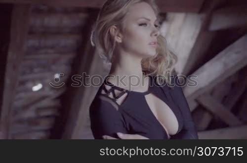 sexy blonde woman in the abandoned building wearing bikini moving