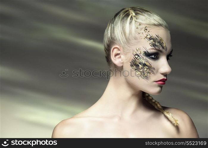 sexy blonde woman posing with cute strong make-up and bride hair-style. Creative beauty shoot