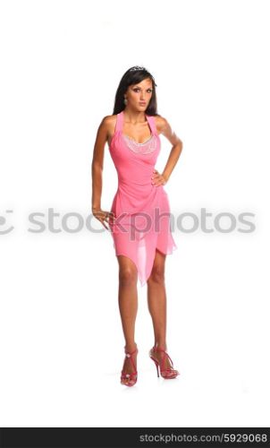 Sexy brunette lady in pink dress isolated on white.