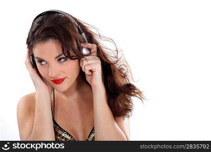 Sexy brunette wearing headphones