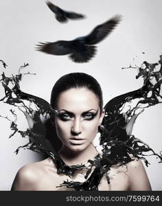 sexy brunette woman with black splash and crows