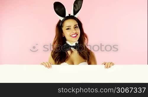 sexy bunny female woman holding a board