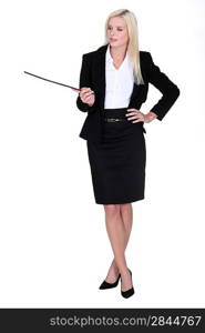 sexy businesswoman holding a stick