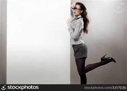 Sexy businesswoman next to the white board