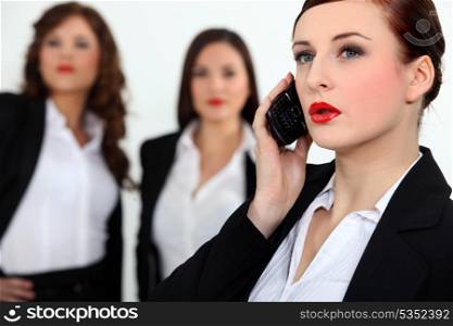 Sexy businesswomen with a cellphone