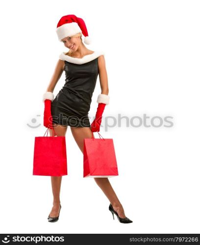 Sexy Christmas girl with red shopping bags. Advertising Space;