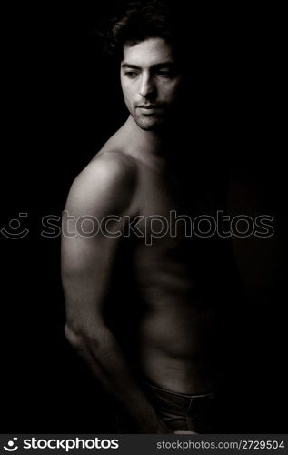 sexy Fashion shot of young man in studio,indoor