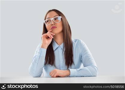 Sexy fashionable asian business woman sitting alone at office