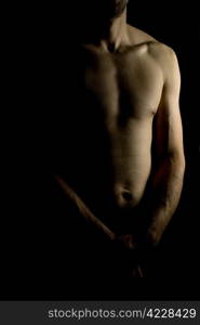 sexy fit naked male body on black background low key