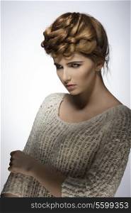 sexy girl in fashion pose with elegant creative hair-style and natural make-up