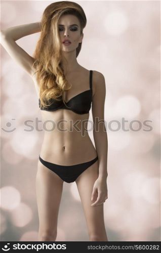 sexy girl with perfect body and cute hair-style posing with black lingerie