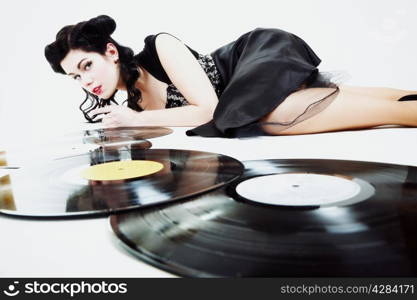 Sexy girl with phonography analogue record music lover studio shot
