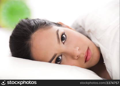 sexy lady lying in her bed,closeup shot over white background