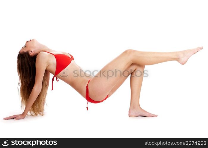Sexy lady wearing swimsuit and posing in a studio environment
