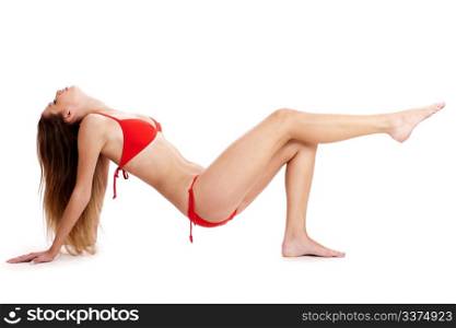 Sexy lady wearing swimsuit and posing in a studio environment